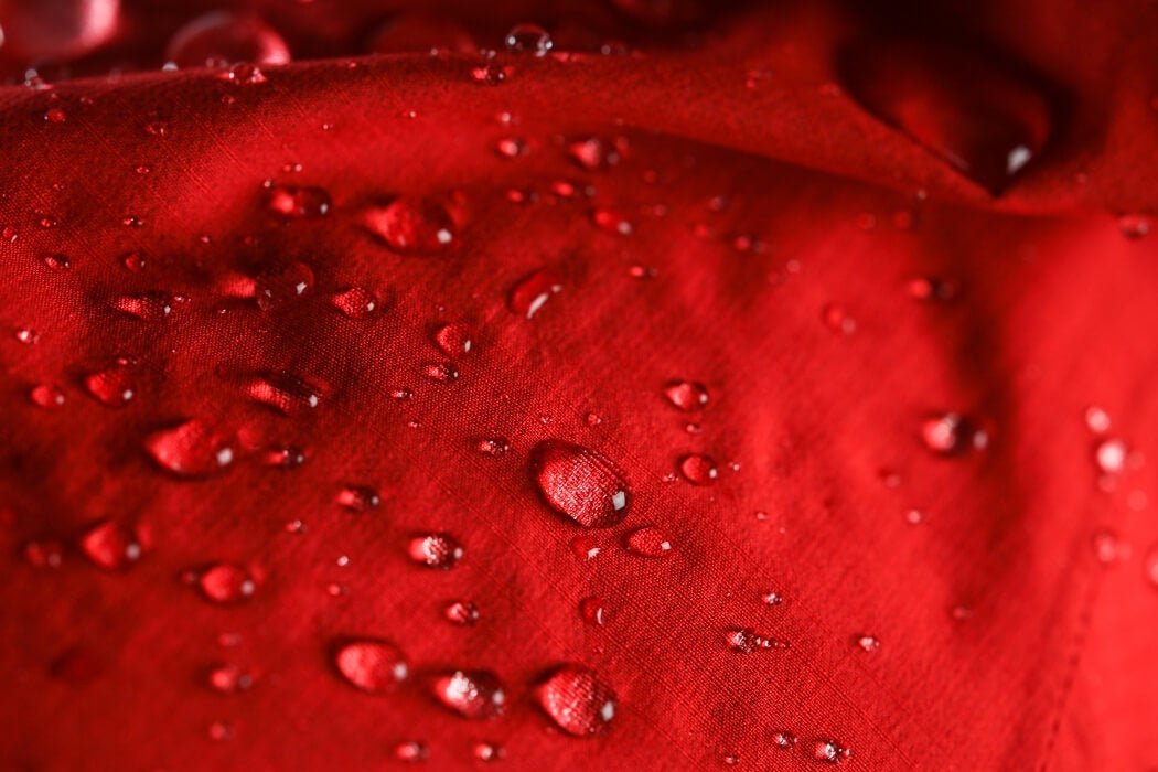 Beads of water sitting on a waterproof jacket